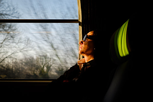 woman in the light on a bus