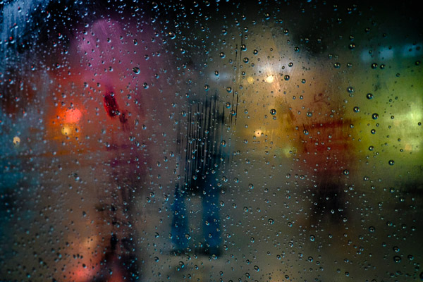 artistic shot with raindrops on a pane of glass