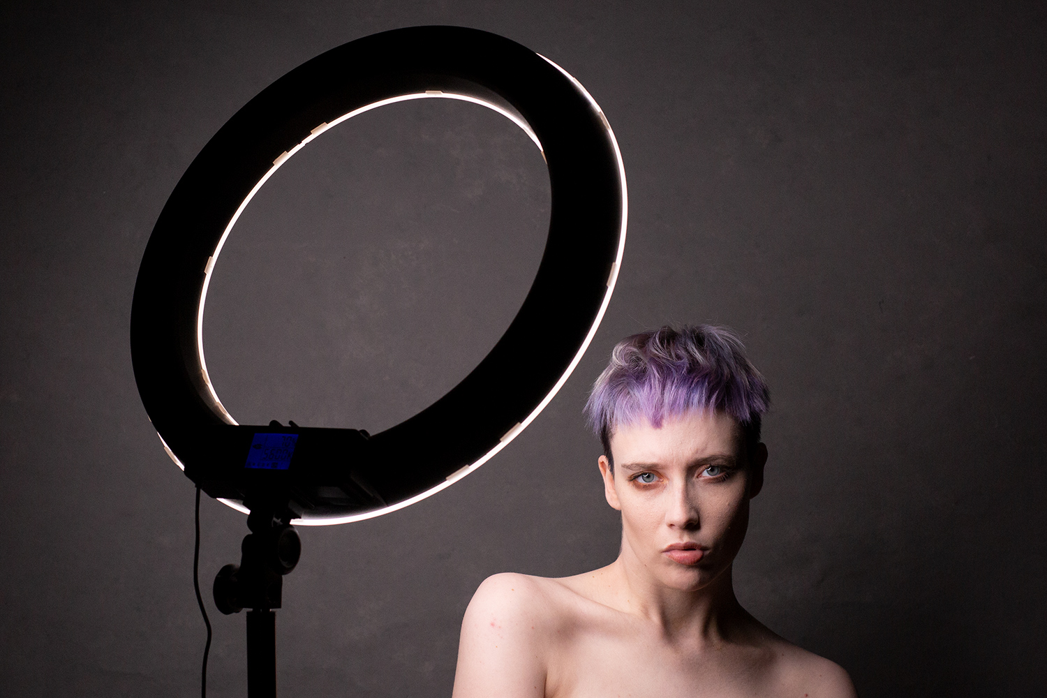 woman with ring light nearby